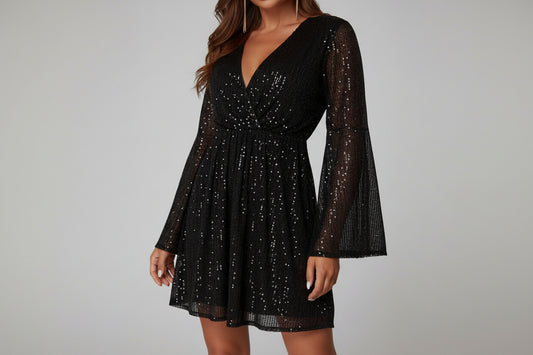 Woman wearing a black sequin mini dress.