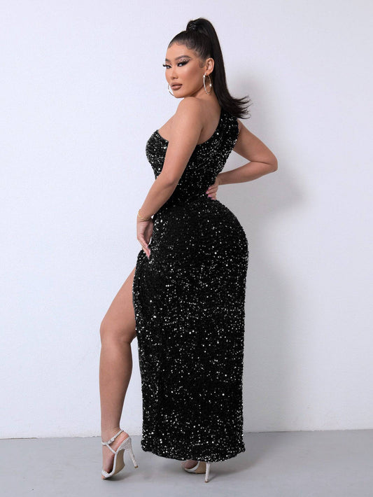 Woman wearing a black sequin dress with a high slit on a white background